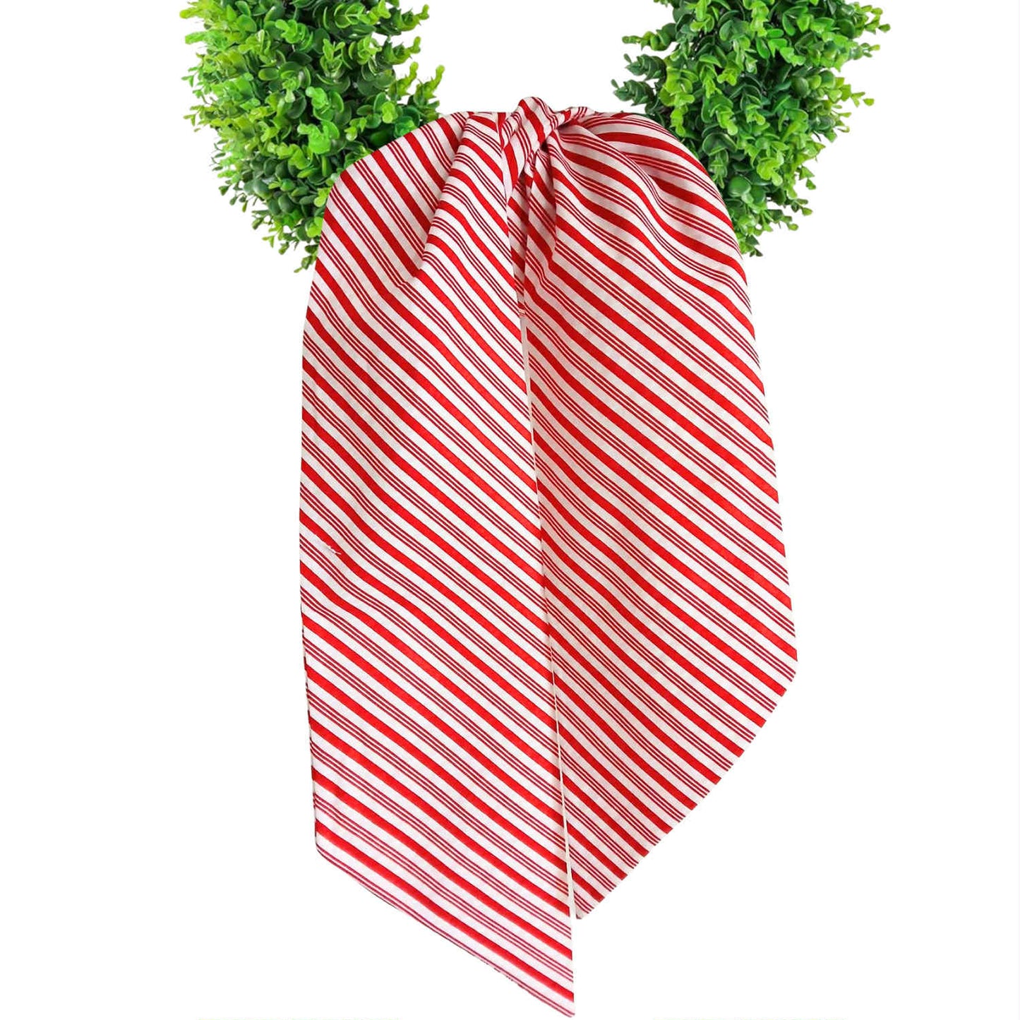 Red and white striped wreath sash with green wreath on a white background